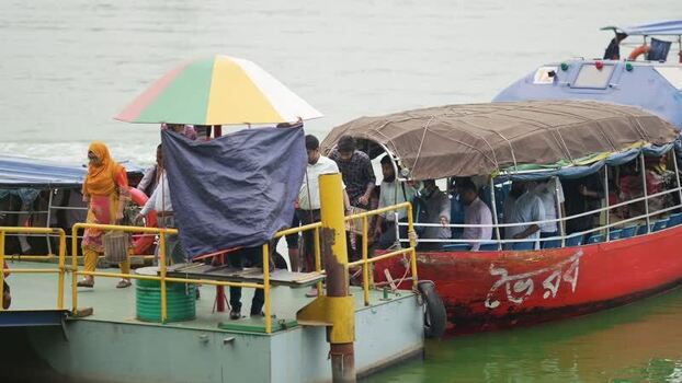 View of people boarding a passenger ferry in Dhaka Bangladesh.