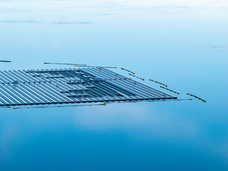 Aerial view of the floating solar system at Cottbuser Ostsee a former open pit mine currently undergoing repair works after storm damage in Cottbus Brandenburg Germany. Aerial view of the floating solar system at Cottbuser Ostsee a former open pit mine currently undergoing repair works after storm damage in Cottbus Brandenburg Germany.
