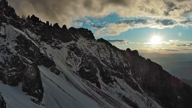 Aerial view of Dolomite Mountains at sunset in Italy.
