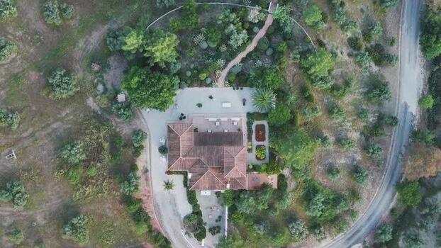 Aerial view of a luxury villa and gardens Spain.