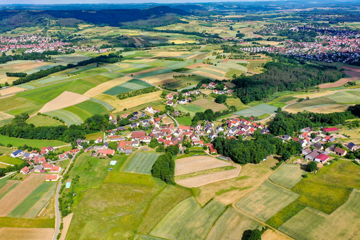 Aerial view of the historic town of Neunkirchen am Brand surrounded by a patchwork of agricultural fields and lush green meadows in Neunkirchen am Brand Bavaria Germany. Aerial view of the historic town of Neunkirchen am Brand surrounded by a patchwork of agricultural fields and lush green meadows in Neunkirchen am Brand Bavaria Germany.