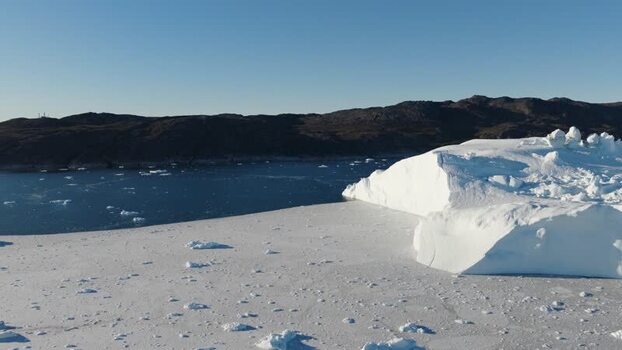 Aerial view of Ilulissat glacier and icebergs in Greenland.
