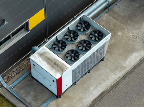 Aerial view of industrial cooling system with multiple fans installed on the concrete roof of a logistics center in Warsaw Masovian Voivodeship Poland. Aerial view of industrial cooling system with multiple fans installed on the concrete roof of a logistics center in Warsaw Masovian Voivodeship Poland.