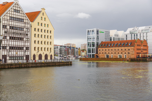 Gdansk Poland 05 September 2026 View of the historic waterfront featuring the National Maritime Museum and modern buildings along the Motlawa River. Gdansk Poland 05 September 2026 View of the historic waterfront featuring the National Maritime Museum and modern buildings along the Motlawa River.