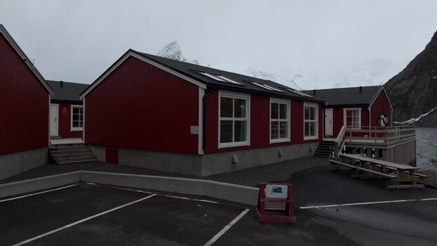Aerial view of red cabins in Lofoten Norway.