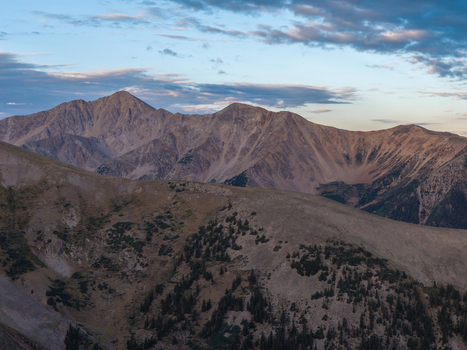 Aerial view of Huron Peak Missouri Mountain and the surrounding rugged landscape of the Missouri Gulch Trail under a soft morning sky in Buena Vista Colorado United States.