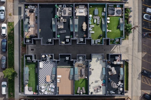 Aerial view of modern townhouses with rooftop terraces and lounge areas in the Cherry Creek neighborhood of Denver Colorado United States. Aerial view of modern townhouses with rooftop terraces and lounge areas in the Cherry Creek neighborhood of Denver Colorado United States.