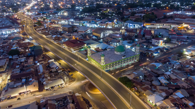 Aerial view of Tamale Central Mosque illuminated at night surrounded by urban streets and city lights in Tamale Northern Region Ghana. Aerial view of Tamale Central Mosque illuminated at night surrounded by urban streets and city lights in Tamale Northern Region Ghana.