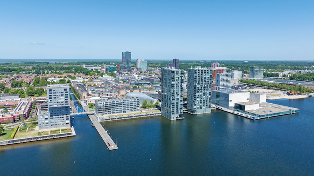 Aerial view of modern high rise residential buildings and the Kunstlinie cultural center along the Weerwater lake in Almere Flevoland Netherlands. Aerial view of modern high rise residential buildings and the Kunstlinie cultural center along the Weerwater lake in Almere Flevoland Netherlands.