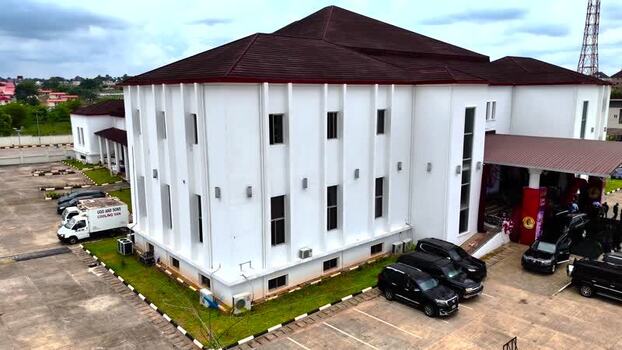 Aerial view of a white building with an entrance canopy Nigeria.