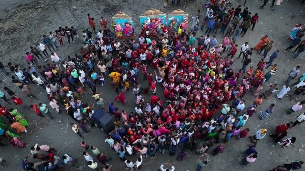 Aerial view of a festival crowd with colorful idols Bangladesh.