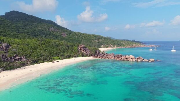 Aerial view of Anse Reunion beach with granite boulders Seychelles.
