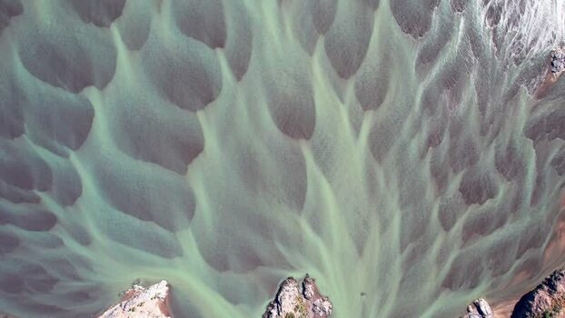 Aerial view of river sand patterns and mountains in Chile. Aerial view of river sand patterns and mountains in Chile.