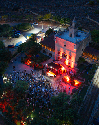 Mgarr Malta 17 September 2026 Aerial view of Castello Zamittello illuminated at night with a large crowd attending an outdoor music event in the courtyard. Mgarr Malta 17 September 2026 Aerial view of Castello Zamittello illuminated at night with a large crowd attending an outdoor music event in the courtyard.
