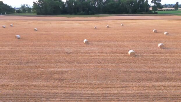 Aerial view of hay bales in the rural Geneva countryside Switzerland.
