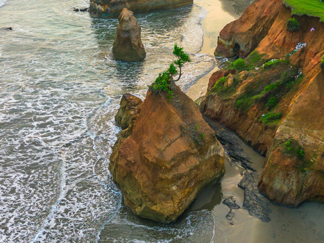 Aerial view of rocky sea stacks and cliffs along the coastline in Bali Indonesia. Aerial view of rocky sea stacks and cliffs along the coastline in Bali Indonesia.