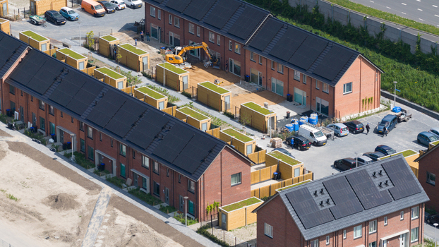 Aerial view of modern terraced houses with solar panels and green roofed sheds in Utrecht Utrecht Netherlands. Aerial view of modern terraced houses with solar panels and green roofed sheds in Utrecht Utrecht Netherlands.