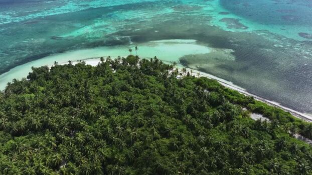 Aerial view of a tropical island with turquoise waters Maldives. Aerial view of a tropical island with turquoise waters Maldives.