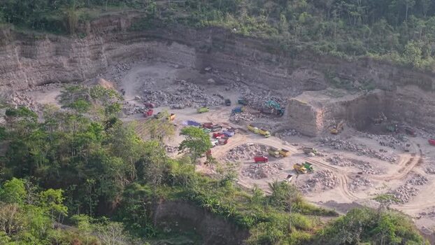 Aerial view of trucks in a quarry Indonesia. Aerial view of trucks in a quarry Indonesia.