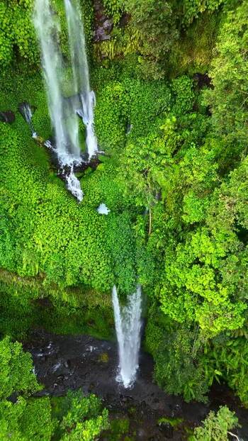 Aerial view of Sendang Gile Waterfall in the jungle Indonesia. Aerial view of Sendang Gile Waterfall in the jungle Indonesia.