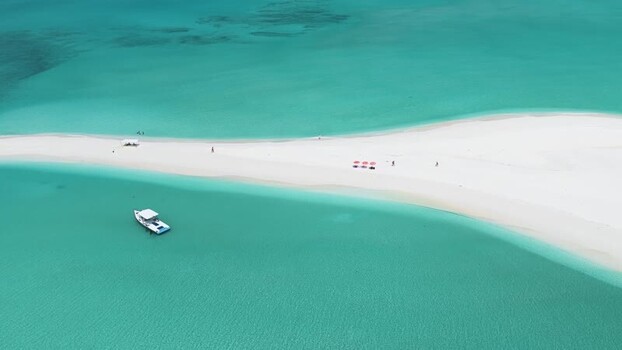 Aerial view of a white sandbank and boat in turquoise water Maldives. Aerial view of a white sandbank and boat in turquoise water Maldives.