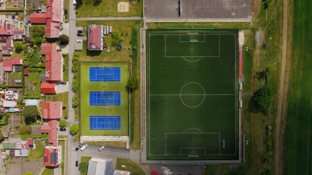 Aerial view of sports fields and houses in Otnice Czechia. Aerial view of sports fields and houses in Otnice Czechia.
