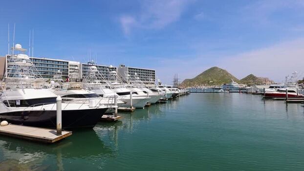 View of Cabo San Lucas marina with luxury yachts Mexico.