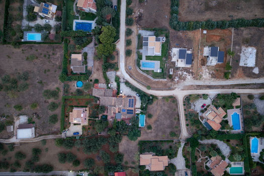 Aerial view of residential villas with swimming pools and olive groves near the Riserva Naturale Orientata dello Zingaro in San Vito Lo Capo Sicilia Italy. Aerial view of residential villas with swimming pools and olive groves near the Riserva Naturale Orientata dello Zingaro in San Vito Lo Capo Sicilia Italy.