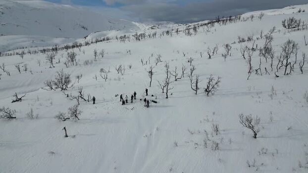 Aerial view of people on the snowy slopes of Kvaloya Norway.