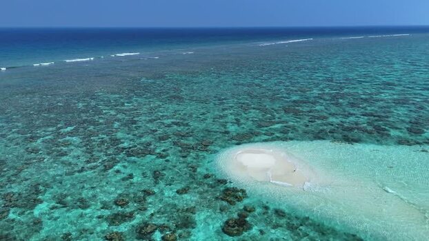 Aerial view of a small sandbank and coral reef in Thoddoo Maldives. Aerial view of a small sandbank and coral reef in Thoddoo Maldives.