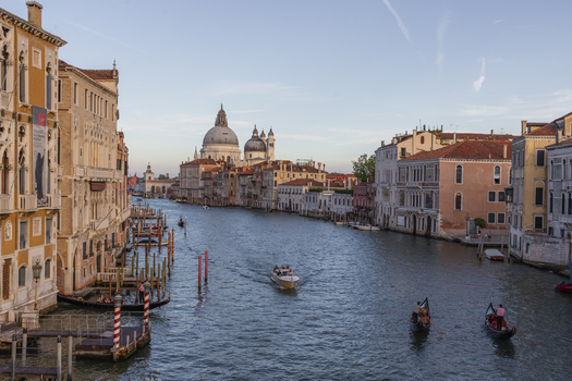 Venice Italy 21 September 2026 View of the Grand Canal with gondolas traditional boats and the iconic Basilica di Santa Maria della Salute in the background under a clear sky. Venice Italy 21 September 2026 View of the Grand Canal with gondolas traditional boats and the iconic Basilica di Santa Maria della Salute in the background under a clear sky.