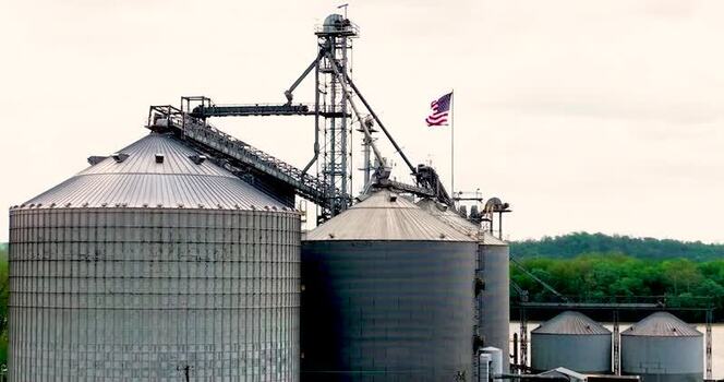 Aerial view of industrial grain silos and storage tanks United States. Aerial view of industrial grain silos and storage tanks United States.