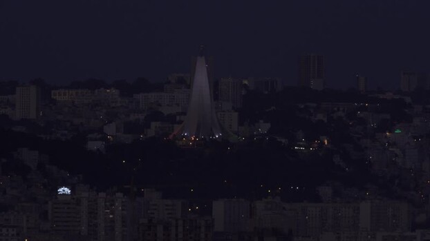 Aerial view of Martyrs Memorial at night in Algeria.