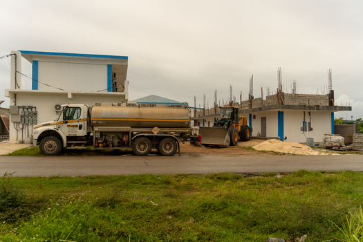 San Jose Tinian Northern Mariana Islands 05 July 2026 View of a fuel delivery truck parked beside a building under construction in San Jose. San Jose Tinian Northern Mariana Islands 05 July 2026 View of a fuel delivery truck parked beside a building under construction in San Jose.