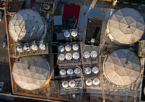 Aerial view of a beer industrial complex with large storage tanks industrial piping and metal structures in Santo Domingo Dominican Republic. Aerial view of a beer industrial complex with large storage tanks industrial piping and metal structures in Santo Domingo Dominican Republic.