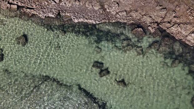 Aerial view of Praia das Avencas coastline in Portugal.