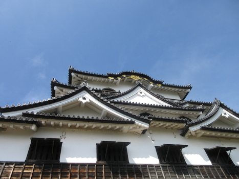 Japan 06 July 2026 View of the traditional white plaster walls and dark tiled gabled roofs of Hikone Castle against a clear blue sky. Japan 06 July 2026 View of the traditional white plaster walls and dark tiled gabled roofs of Hikone Castle against a clear blue sky.