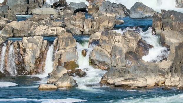 View of Great Falls Park with cascading water over rocks United States. View of Great Falls Park with cascading water over rocks United States.