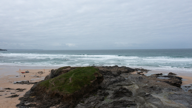 Aerial view of the rugged rocky shoreline and sandy beach at Constantine Bay in Padstow Cornwall United Kingdom. Aerial view of the rugged rocky shoreline and sandy beach at Constantine Bay in Padstow Cornwall United Kingdom.