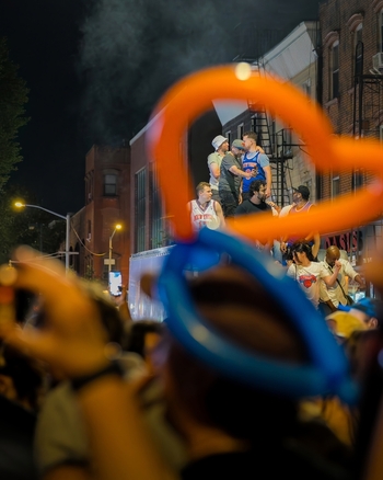 Williamsburg New York USA 14 June 2026 View of Knicks fans celebrating on a float after the NBA Championships with orange and blue balloons in the foreground. Williamsburg New York USA 14 June 2026 View of Knicks fans celebrating on a float after the NBA Championships with orange and blue balloons in the foreground.