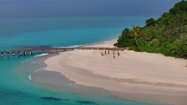 Aerial view of bungalows on stilts Maldives.
