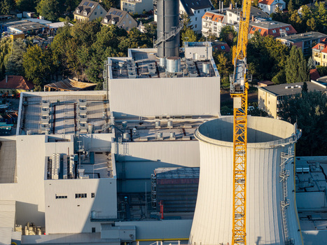 Aerial view of the Combined Heat and Power Plant Lichterfelde during deconstruction featuring a cooling tower a yellow construction crane and industrial buildings in Berlin Berlin Germany. Aerial view of the Combined Heat and Power Plant Lichterfelde during deconstruction featuring a cooling tower a yellow construction crane and industrial buildings in Berlin Berlin Germany.