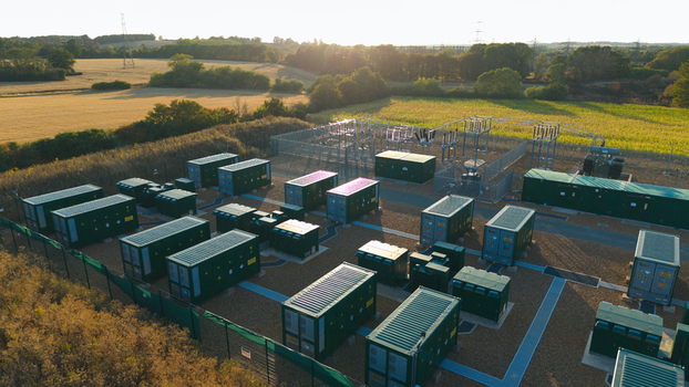 Aerial view of Battery Energy park BESS Grendon with green battery storage containers and electrical infrastructure in rural fields in Northampton England United Kingdom. Aerial view of Battery Energy park BESS Grendon with green battery storage containers and electrical infrastructure in rural fields in Northampton England United Kingdom.