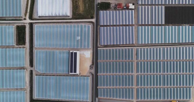 Aerial view of greenhouses and solar panels in Paestum Italy.