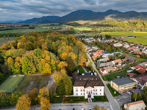 Aerial view of the baroque classicist mansion with its pristine white facade amid the vibrant autumn foliage nestled near the majestic mountain range Mosovce Zilina Region Slovakia. Aerial view of the baroque classicist mansion with its pristine white facade amid the vibrant autumn foliage nestled near the majestic mountain range Mosovce Zilina Region Slovakia.