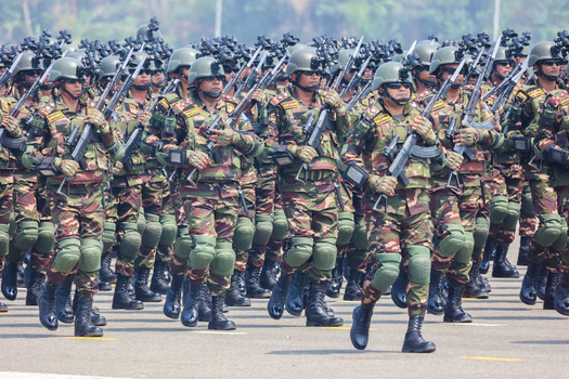 Dhaka Bangladesh 25 March 2026 View of uniformed soldiers marching in precise formation their camouflage blending with the urban landscape.
