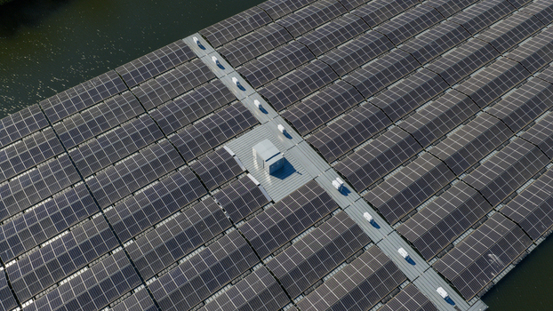 Aerial view of floating solar panels arranged in a geometric grid on a body of water with metal walkways Zwolle Overijssel Netherlands. Aerial view of floating solar panels arranged in a geometric grid on a body of water with metal walkways Zwolle Overijssel Netherlands.