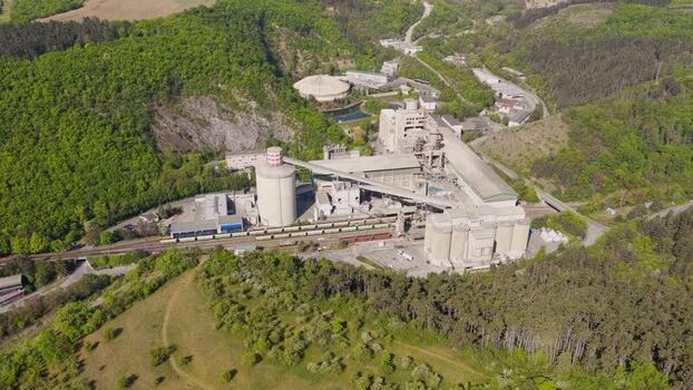 Aerial view of an industrial plant in a green valley Czechia. Aerial view of an industrial plant in a green valley Czechia.