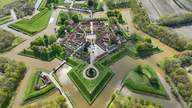 Aerial view of the historic star shaped Fort Bourtange with its green embankments and water filled moats Bourtange Groningen Netherlands. Aerial view of the historic star shaped Fort Bourtange with its green embankments and water filled moats Bourtange Groningen Netherlands.