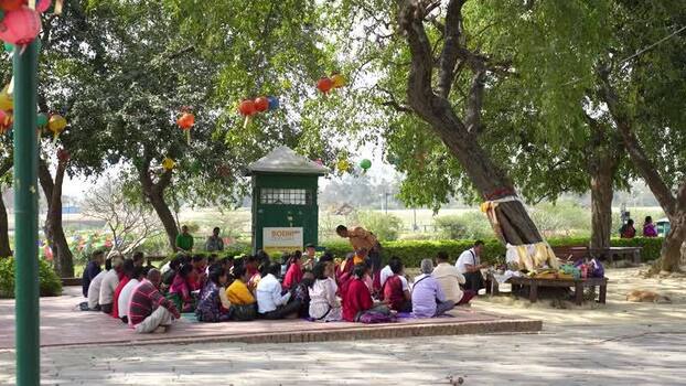 View of people gathered for a ceremony at Lumbini Nepal.